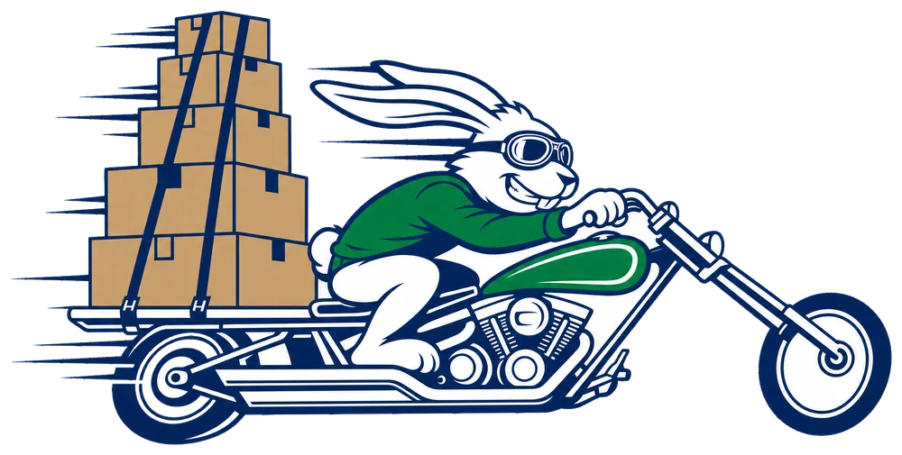 The Quick Supply rabbit on a long motorcycle with boxes strapped on the back